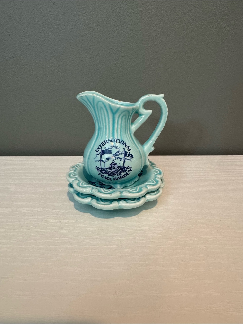 Aqua Ceramic Pitcher with Ruffled Plates - International Peace Garden Motif